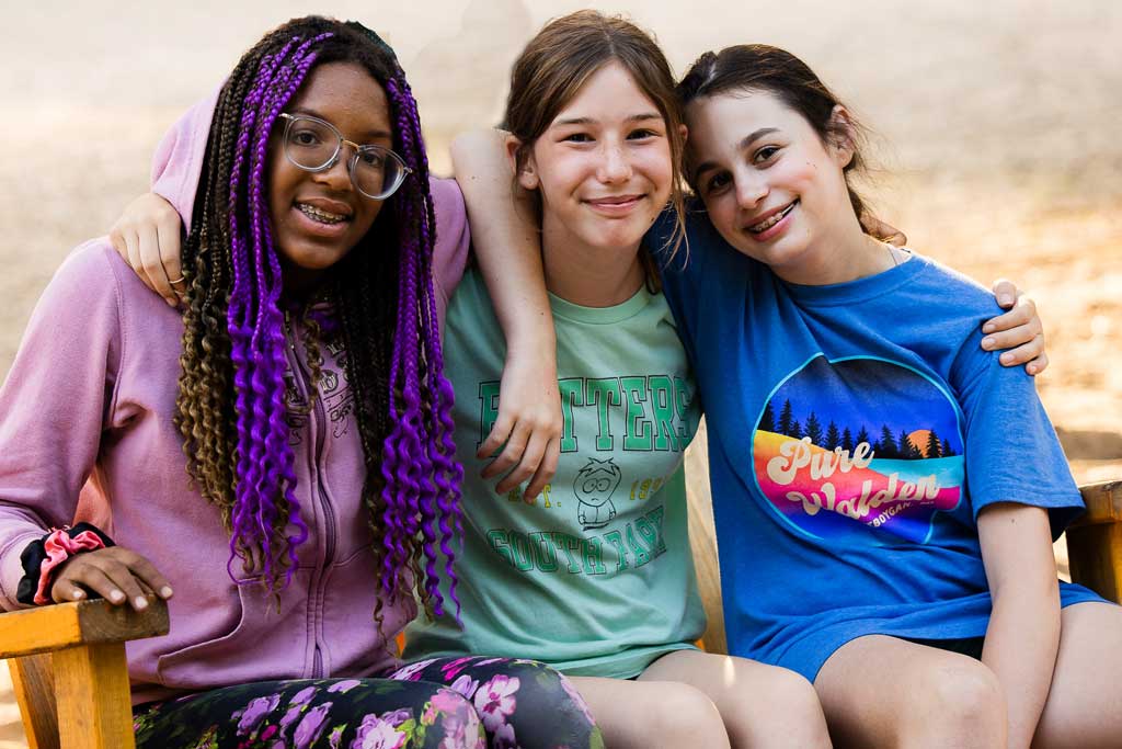 Lila in the middle with her friends on either side